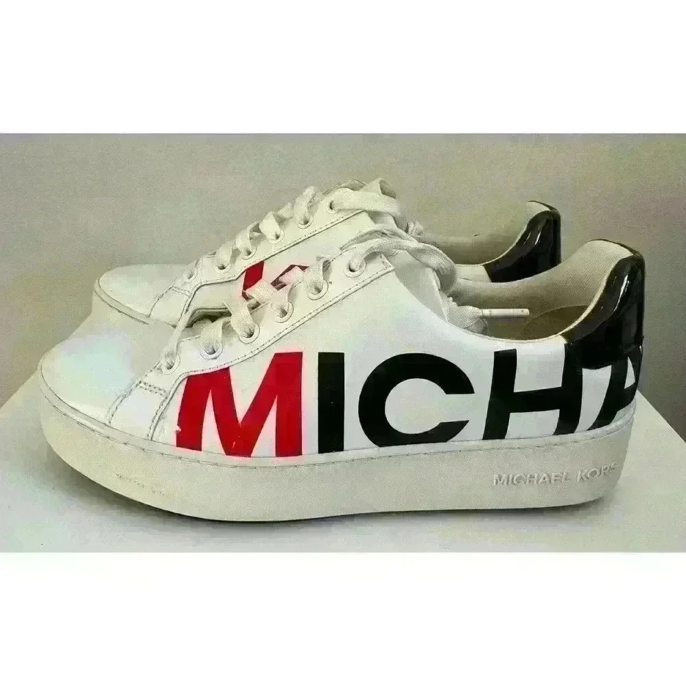 Michael Kors leather sneakers logo wrap around size. 7M  patent leather on back